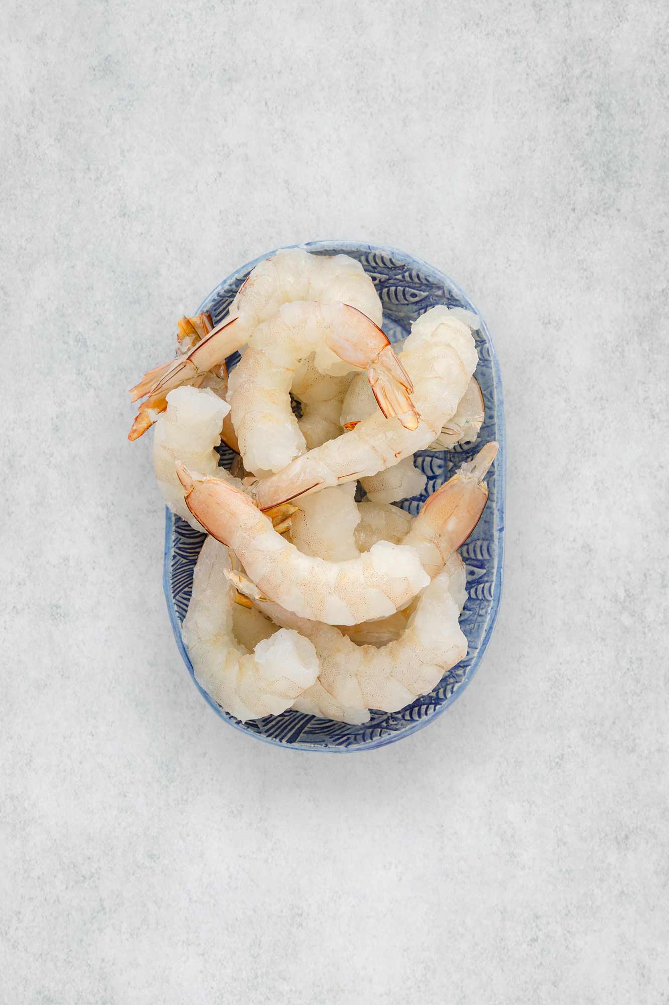 Raw Karumba prawns on a plate