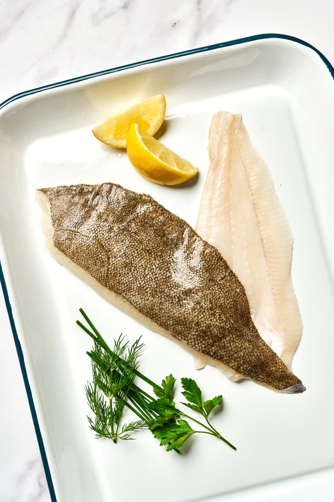 A portion of Brill fillets from Rockfish Online Seafood Market on a baking tray