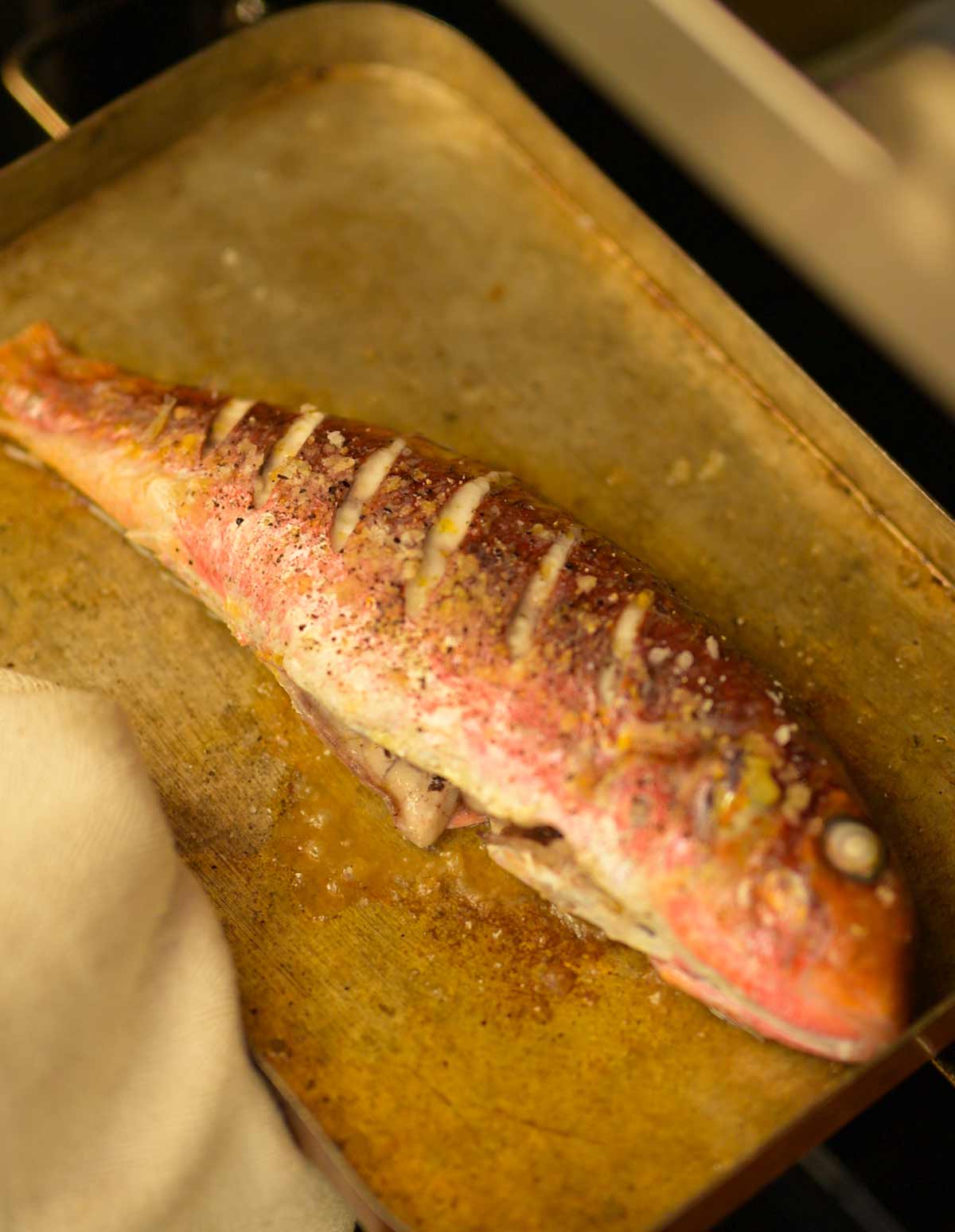 A whole cooked red mullet