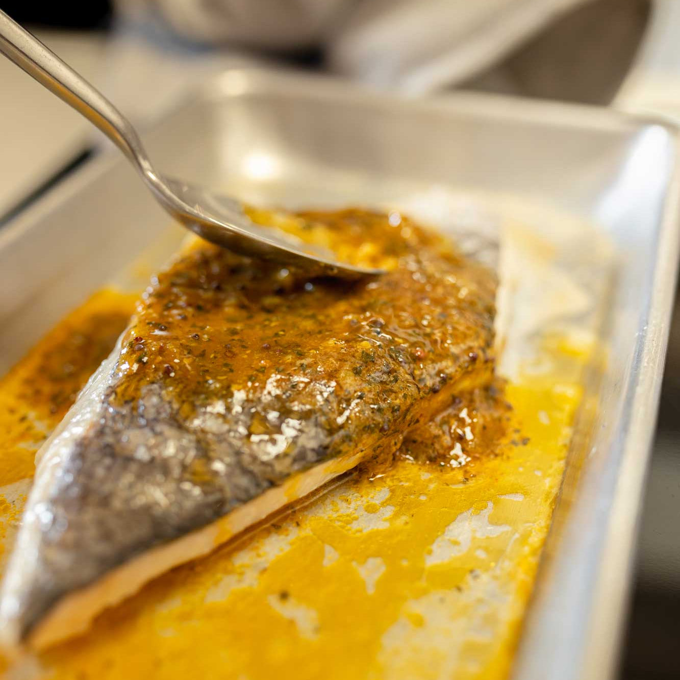 A fillet of have being finished with lime pickle butter from Rockfish