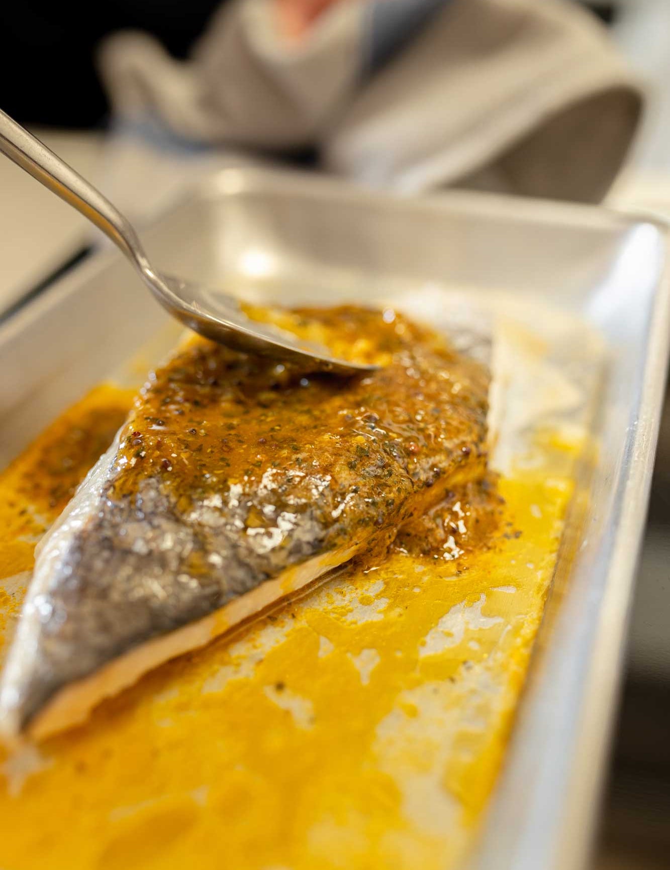 A fillet of have being finished with lime pickle butter from Rockfish