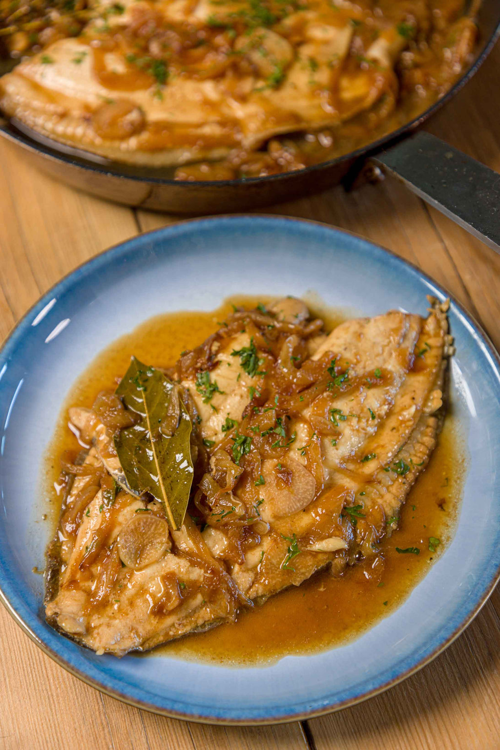 Plaice fillet prepared by Rockfish poached in cider and onions