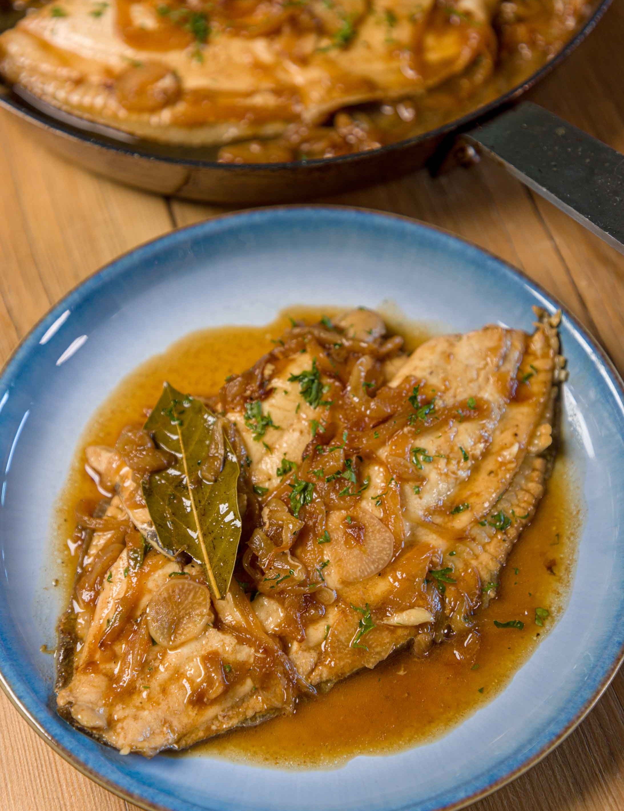 Plaice fillet prepared by Rockfish poached in cider and onions