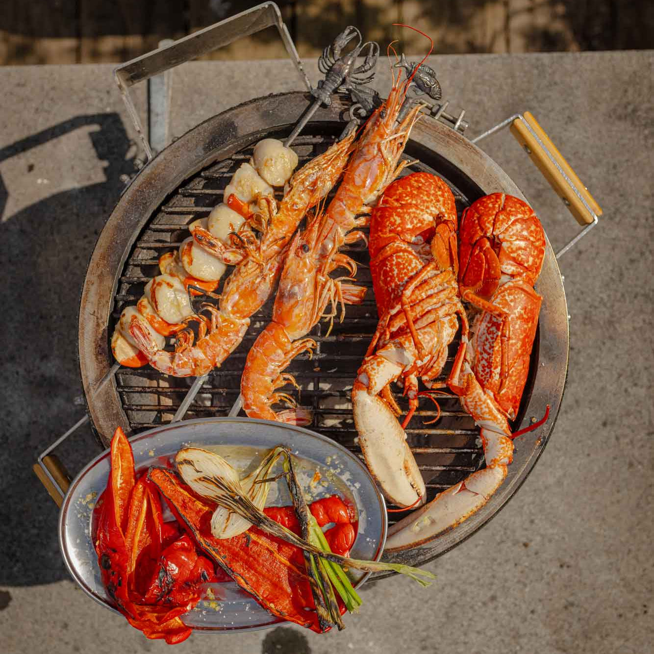 Mixed grill of Rockfish shellfish on a Monolith BBQ