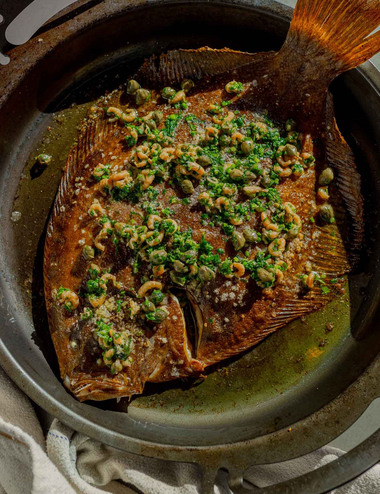 Whole roasted Rockfish brill served with potted shrimp