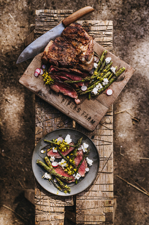 Image of roasted meat on Pipers Farm wooden board