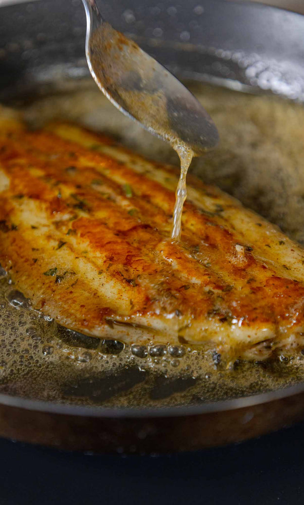 Pan fried Dover Sole being basted in Noisette butter