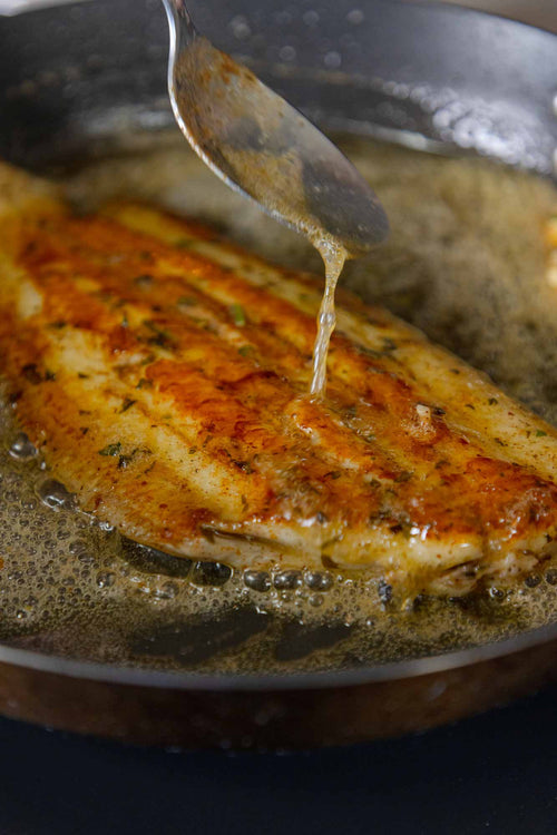 Pan fried Dover Sole being basted in Noisette butter