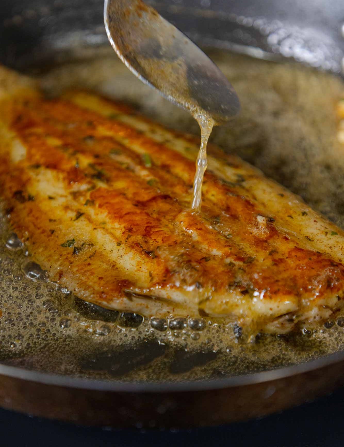 Pan fried Dover Sole being basted in Noisette butter