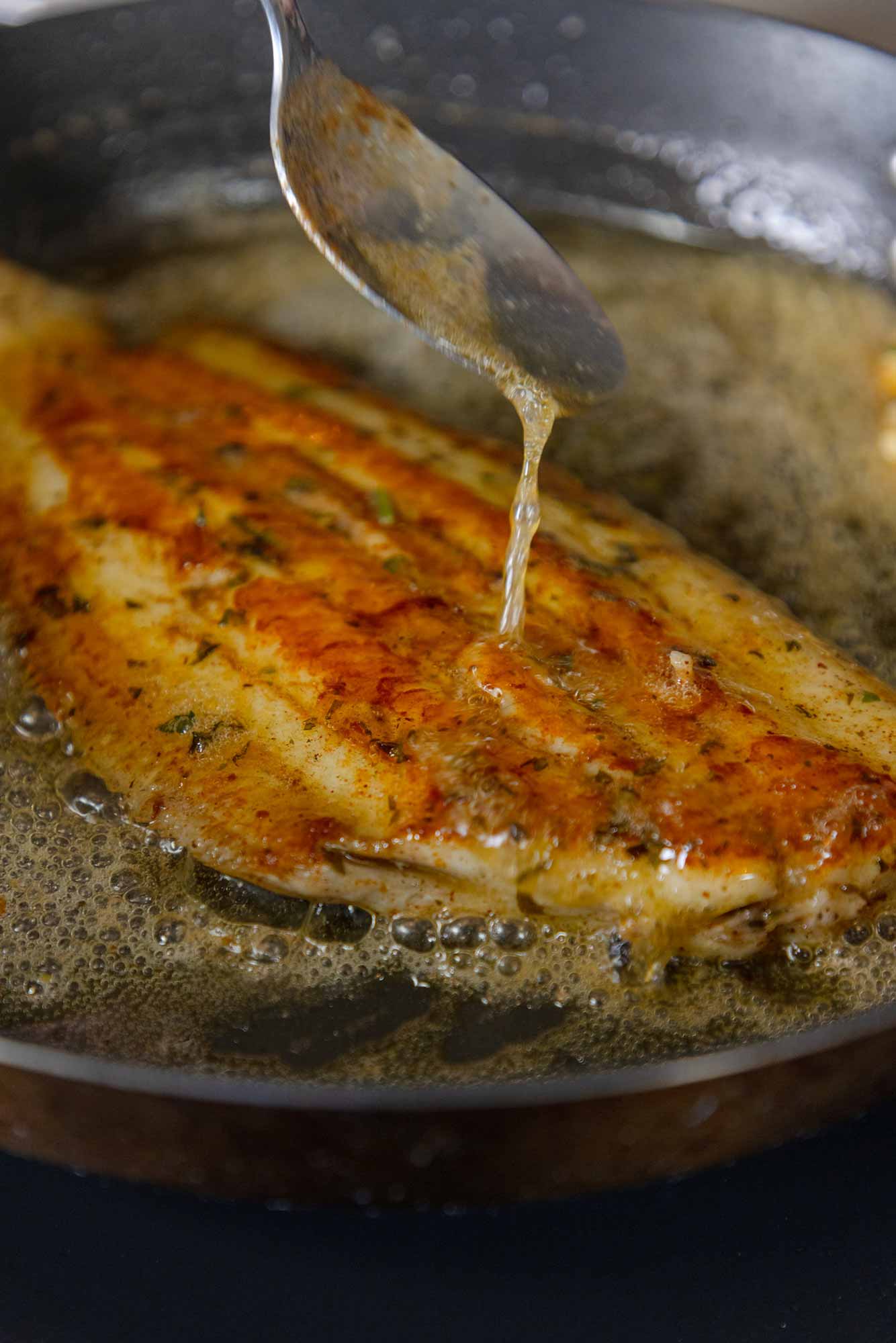 Pan fried Dover Sole being basted in Noisette butter