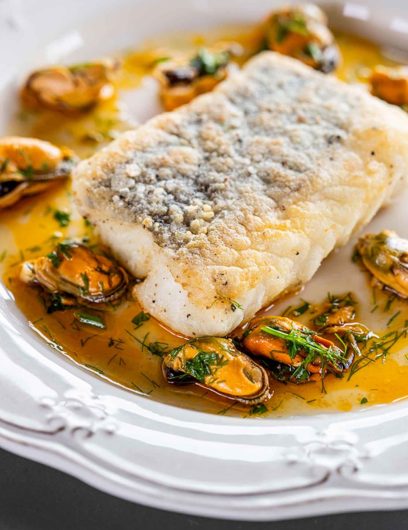 Crispy fillet of hake with Lyme Bay mussels around it 