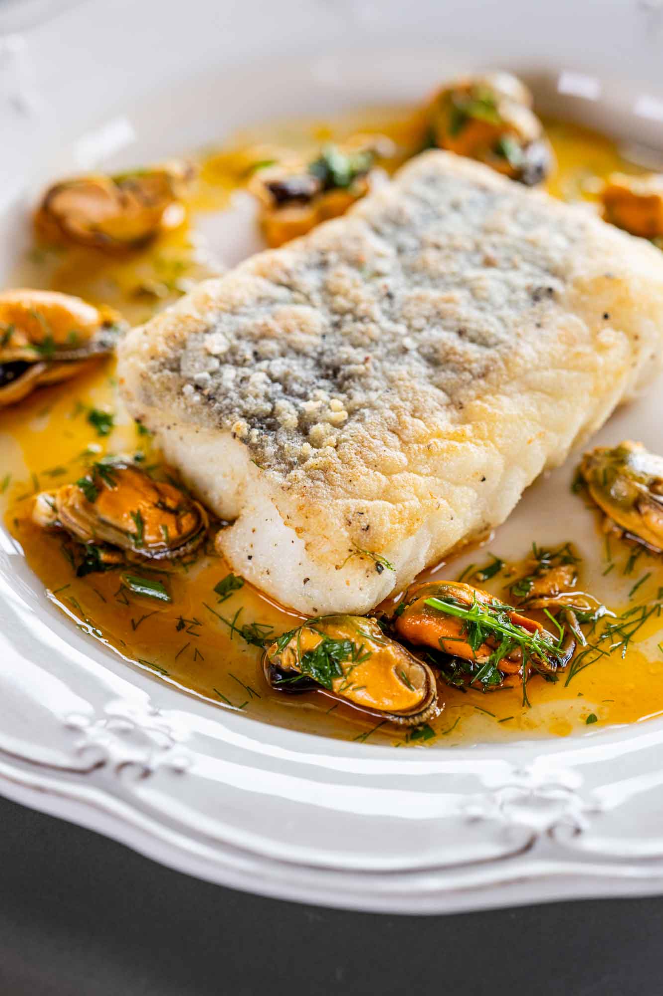 Crispy fillet of hake with Lyme Bay mussels around it 