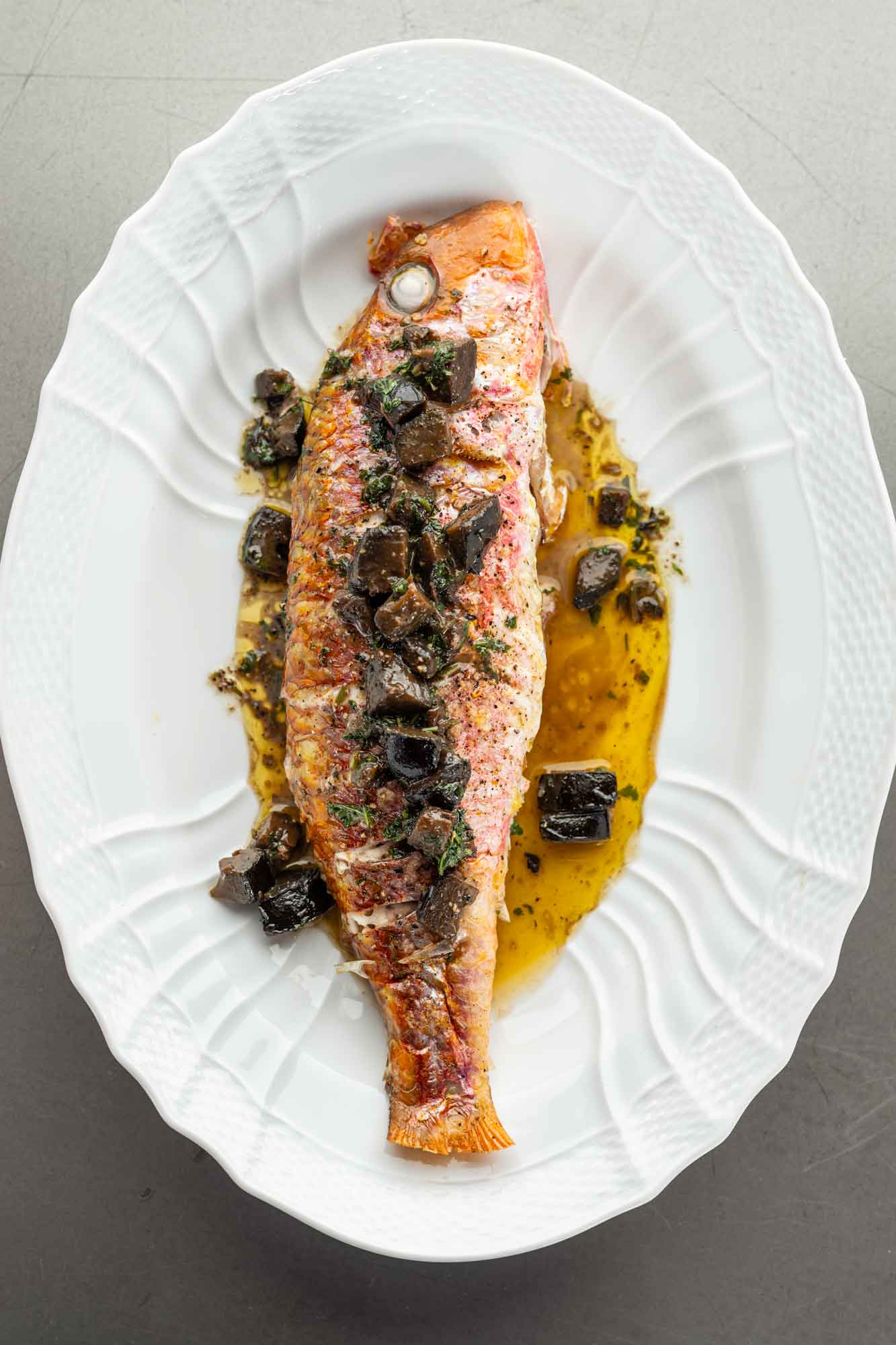 Whole roasted red mullet with pickled walnuts