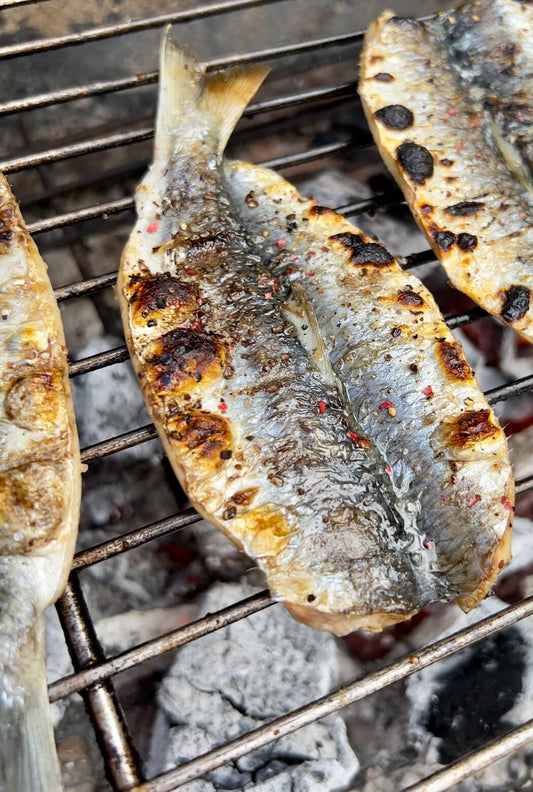 Grilled herring on barbecue