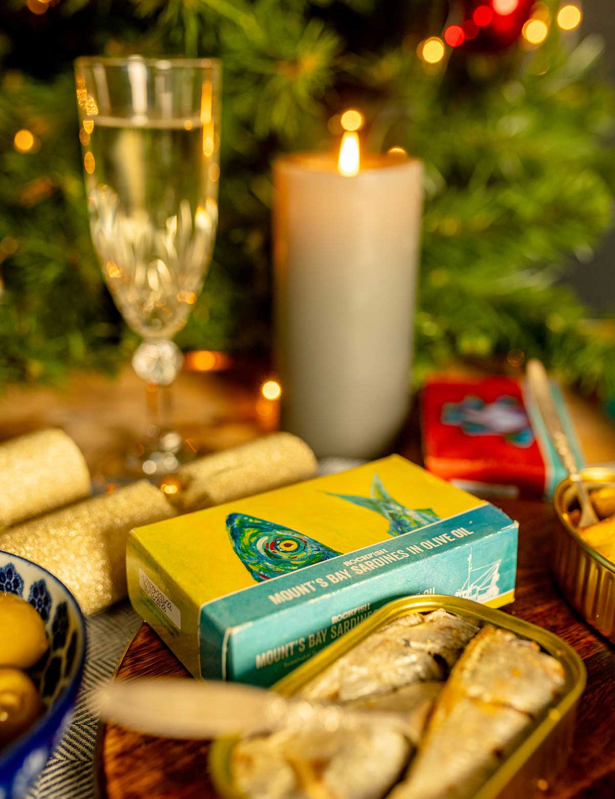Rockfish tinned seafood on a table full of Christmas decorations 