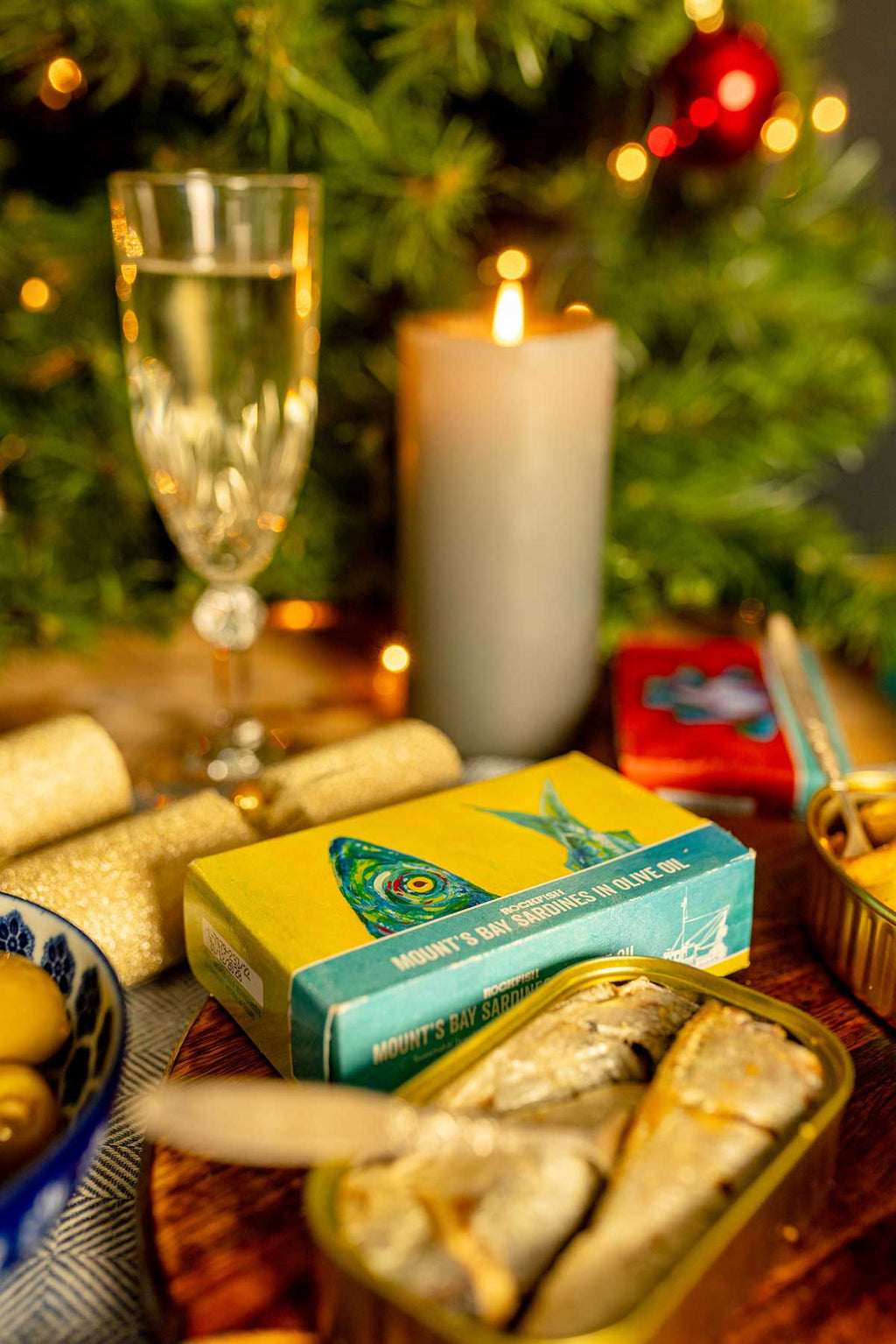 Rockfish tinned seafood on a table full of Christmas decorations 