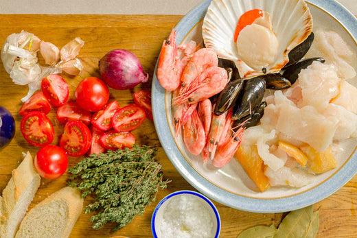 Fish pie ingredients on a chopping board