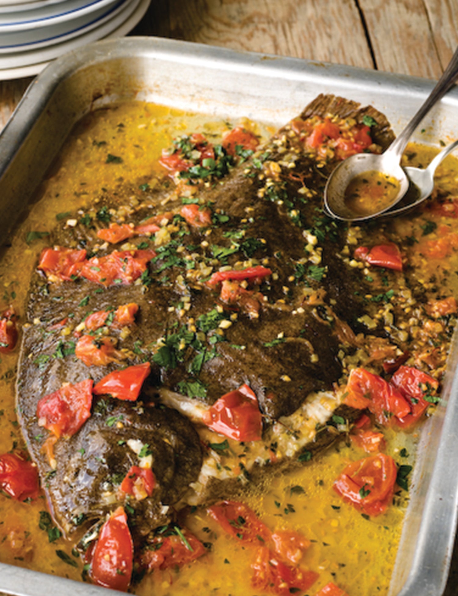 A whole oven poached Rockfish brill with tomatoes, thyme and saffron