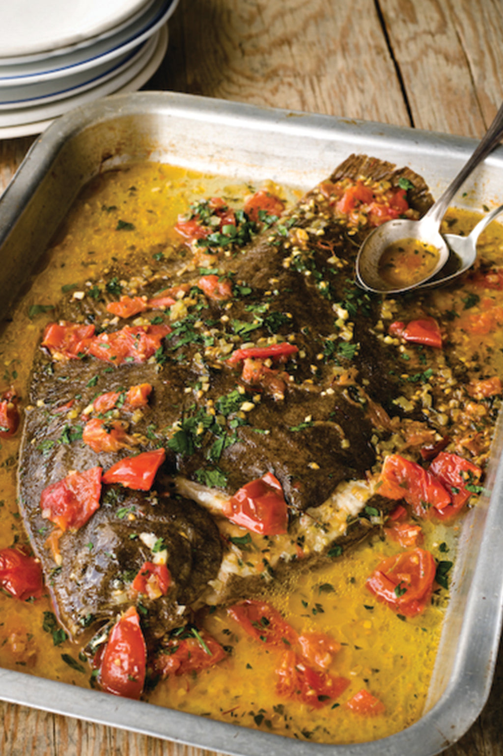 A whole oven poached Rockfish brill with tomatoes, thyme and saffron