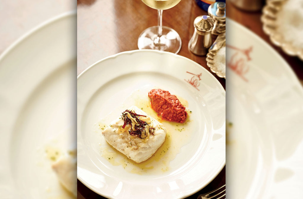 Hake cooked in the Basque style with garlic & sauce Romesco – Rockfish
