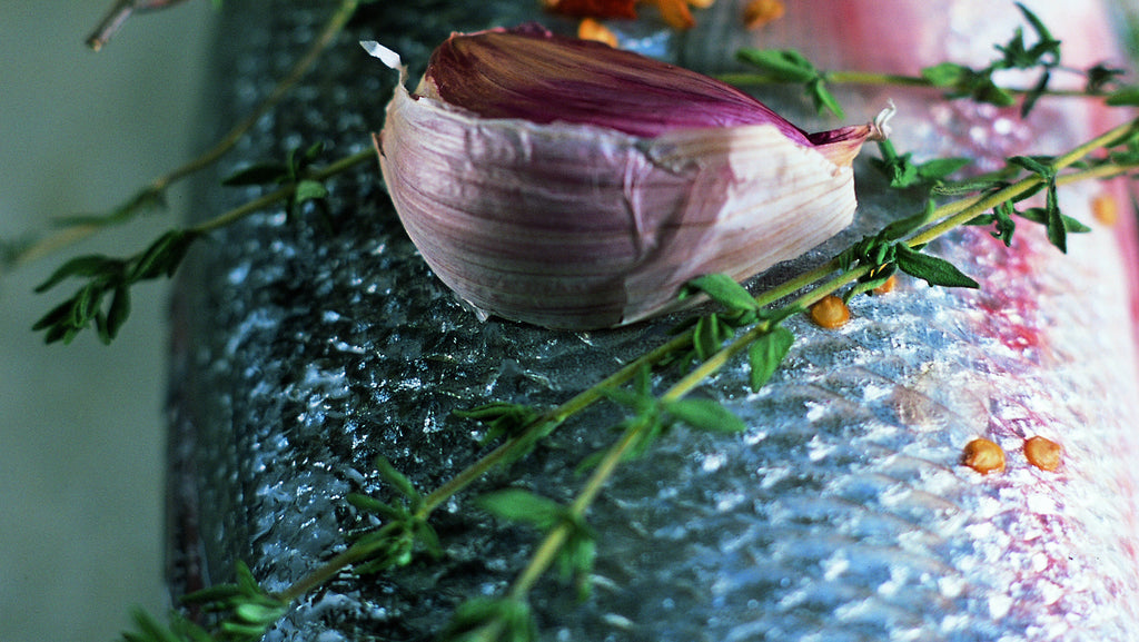 Pan roasted sea bass topped with rosemary and garlic