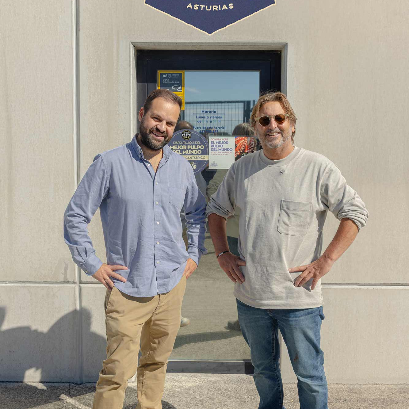 Mitch and Carlos outside his factory