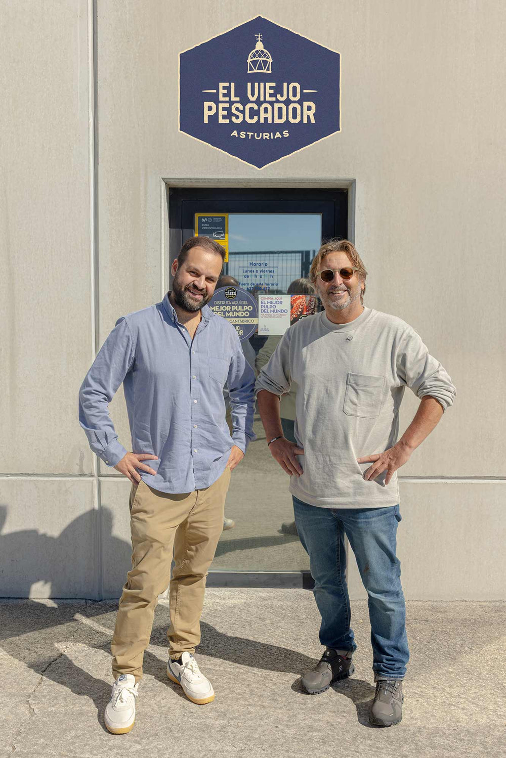 Mitch and Carlos outside his factory