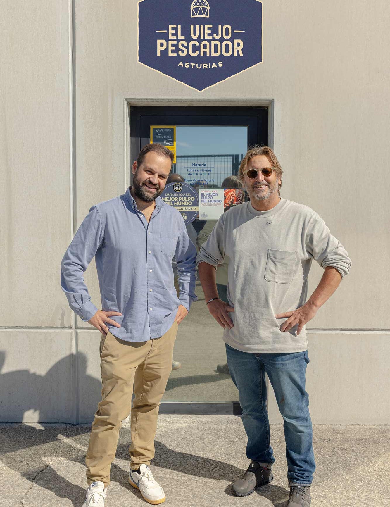 Mitch and Carlos outside his factory