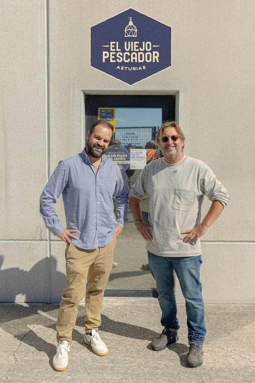 Mitch and Carlos outside his factory