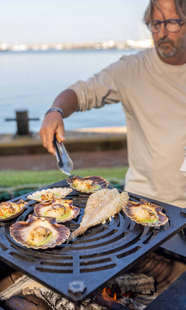 Mitch cooking on Vulcanus BBQ on Brixham harbour