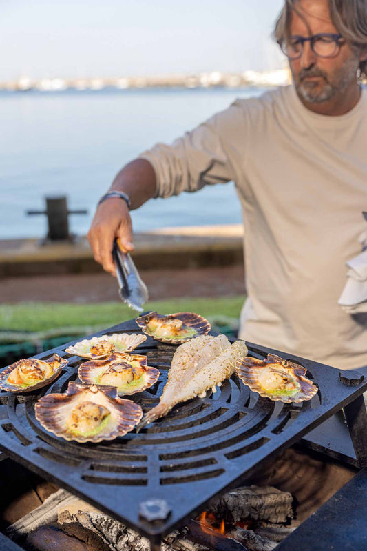 Mitch cooking on Vulcanus BBQ on Brixham harbour