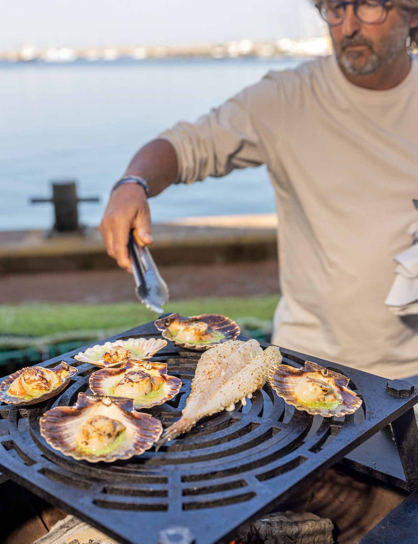 Mitch cooking on Vulcanus BBQ on Brixham harbour