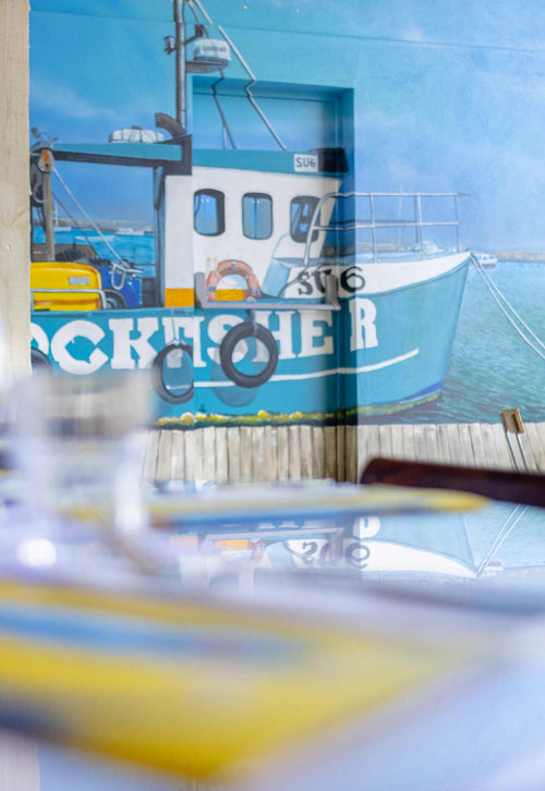 Rockfisher painted on the wall in Salcombe