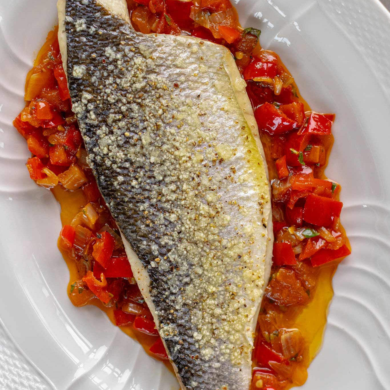 A wild caught sea bass fillet from Brixham prepared by Rockfish online seafood market on Peperonata