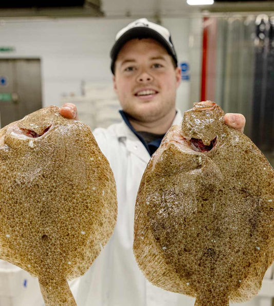 Tommy the fishmonger holding brill