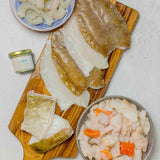 Rockfish seasonal box including Karumba prawns, fish pie mix, lemon sole fillets and two premium fillets of cod and a garlic butter