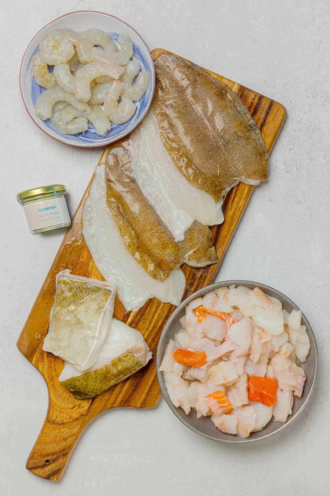 Rockfish seasonal box including Karumba prawns, fish pie mix, lemon sole fillets and two premium fillets of cod and a garlic butter