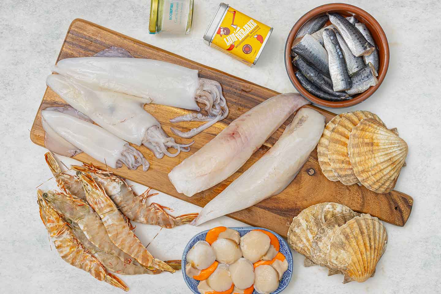 2025 Rockfish Bbq box including, moonfish, squid, skull island prawns, diver scallops with shells , sardines, garlic butter and a free tin of LumberJaxe BBQ seasoning