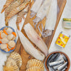 2025 Rockfish Bbq box including, moonfish, squid, skull island prawns, diver scallops with shells , sardines, garlic butter and a free tin of LumberJaxe BBQ seasoning