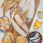 2025 Rockfish Bbq box including, moonfish, squid, skull island prawns, diver scallops with shells , sardines, garlic butter and a free tin of LumberJaxe BBQ seasoning