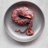 Cooked Salcombe Octopus on a plate