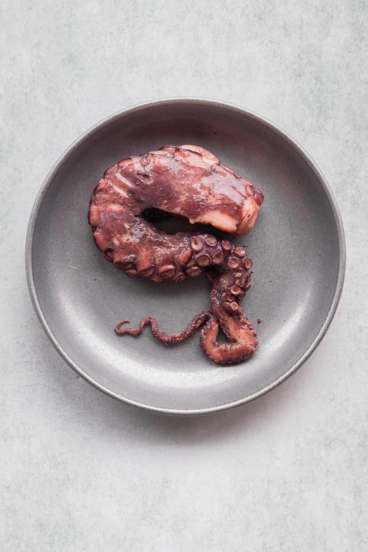 Cooked Salcombe Octopus on a plate