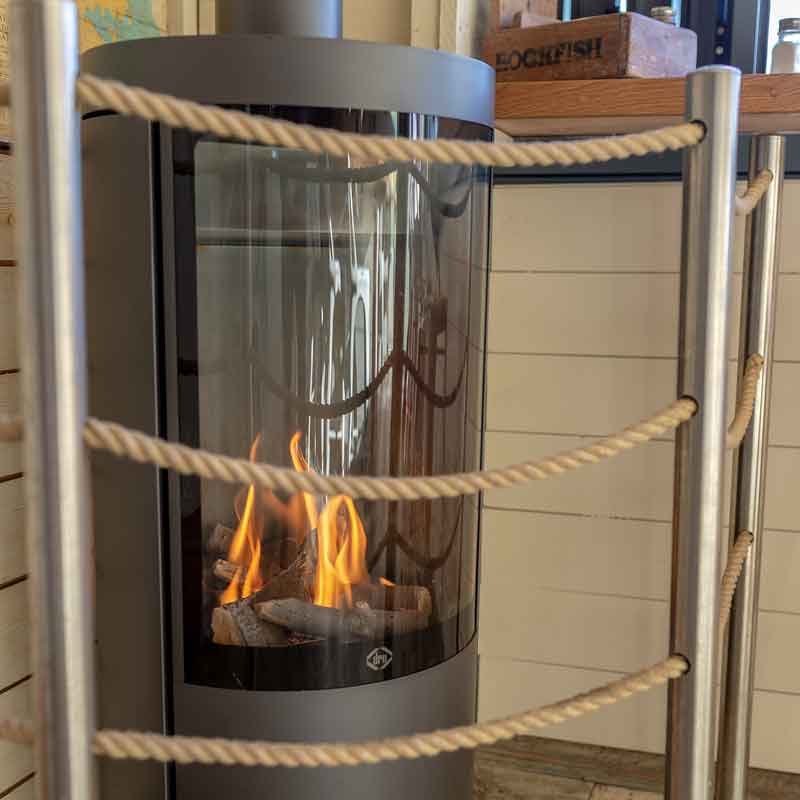 Warm looking fireplace in a Rockfish restaurant