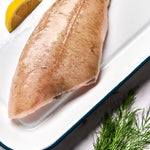 A portion of Megrim sole from Rockfish Online Seafood Market on a baking tray