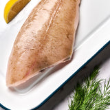 A portion of Megrim sole from Rockfish Online Seafood Market on a baking tray
