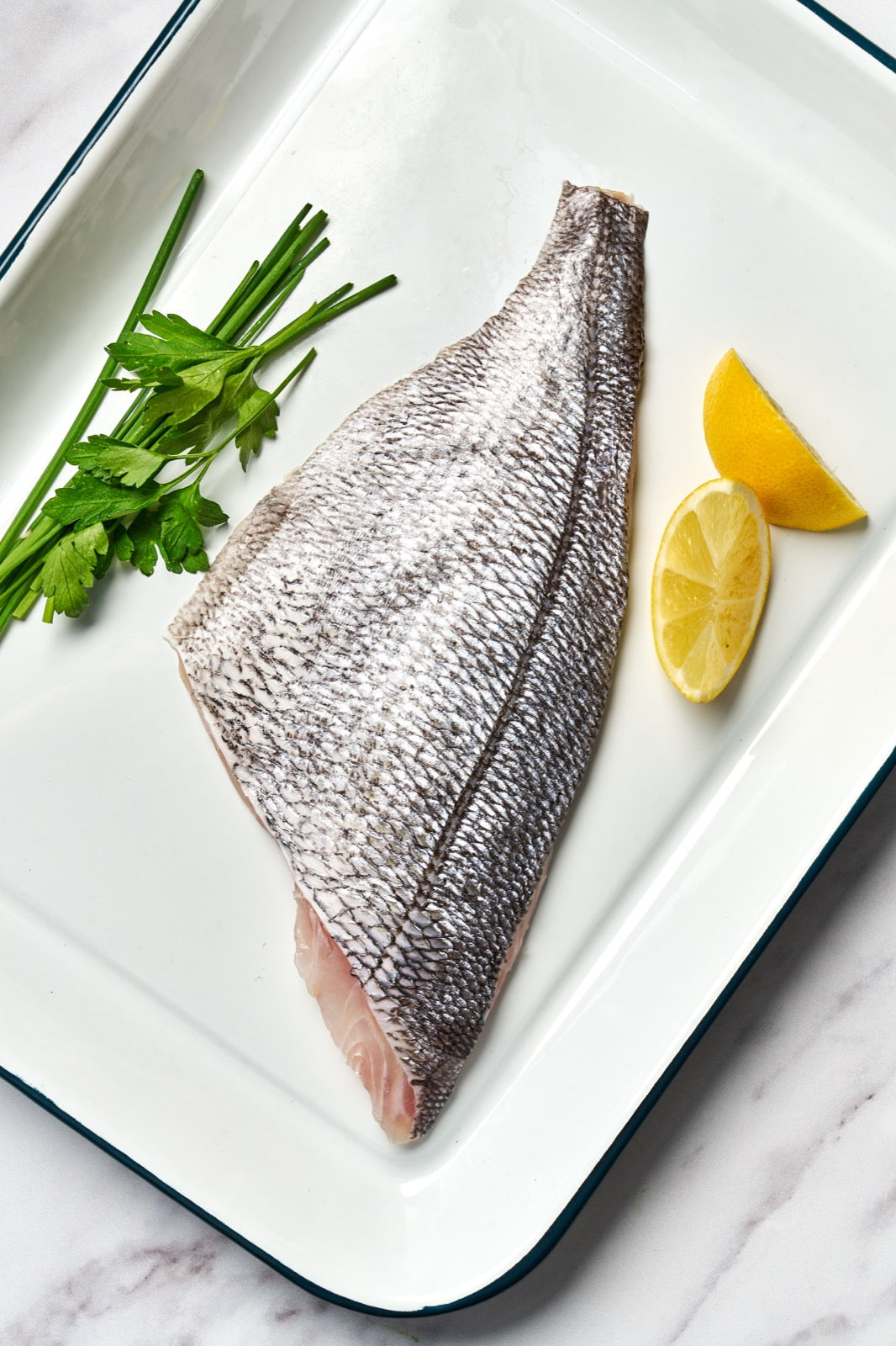 A portion of Black Bream fillet from Rockfish Online Seafood Market on a baking tray