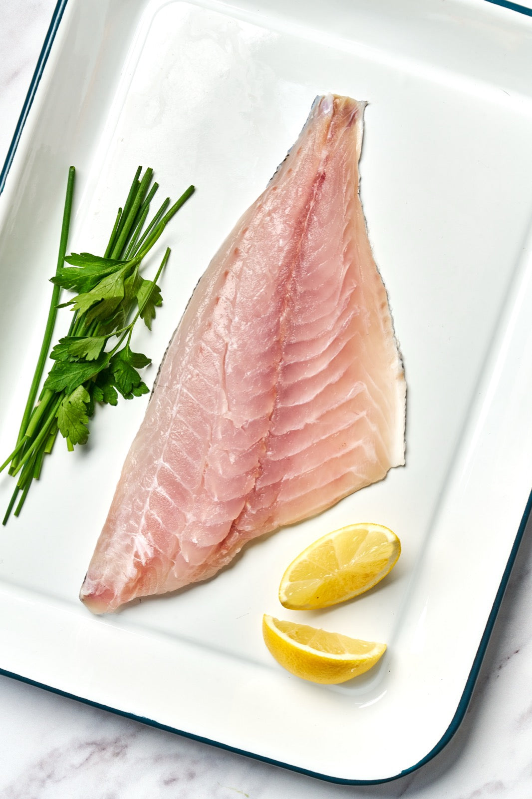 a portion of Black Bream fillet from Rockfish Online Seafood Market on a baking tray