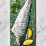 A portion of Seabass fillet from Rockfish Online Seafood Market on a piece of marble