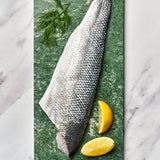 A portion of Seabass fillet from Rockfish Online Seafood Market on a piece of marble