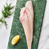 A portion of gurnard fillet from Rockfish Online Seafood Market on a piece of marble